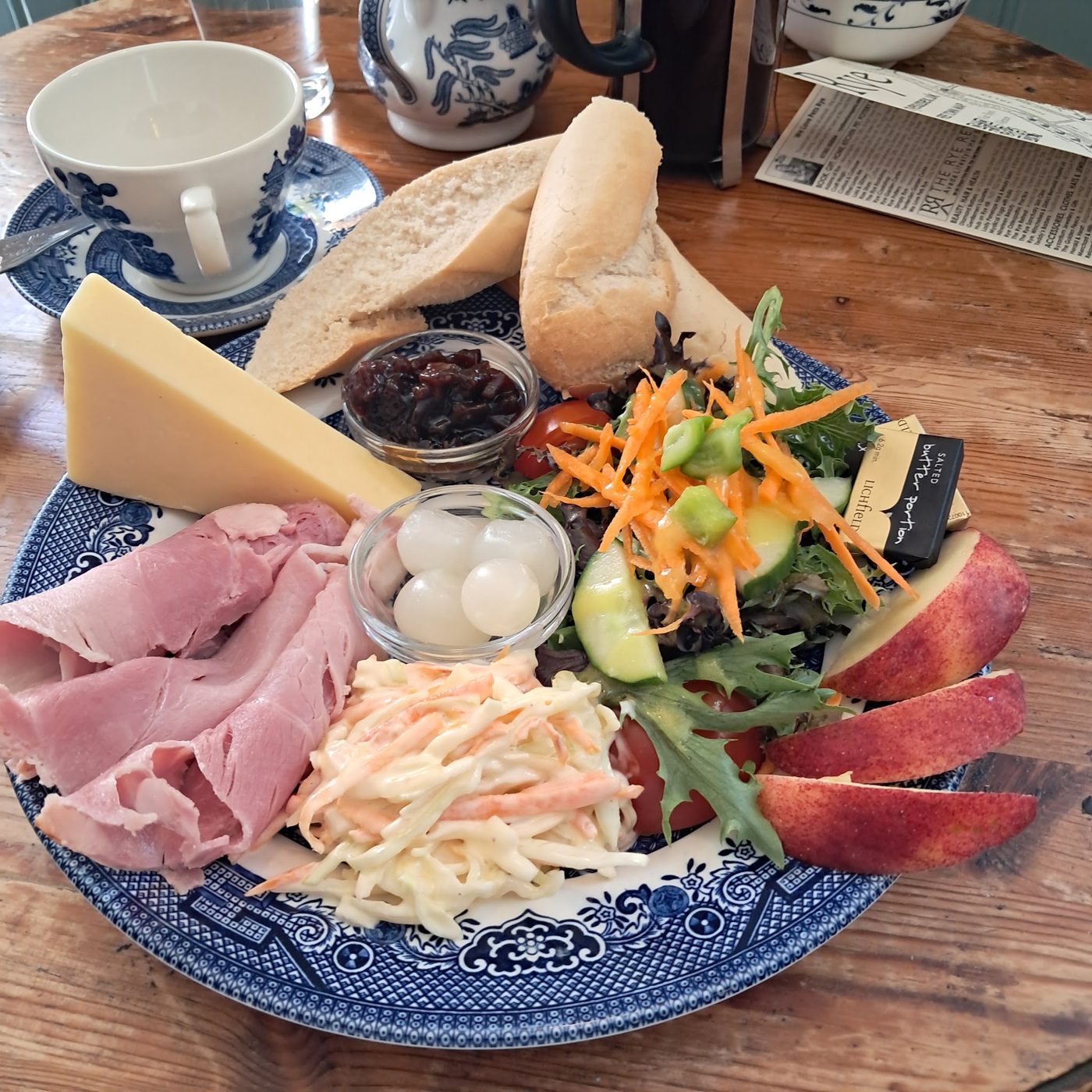 A ploughman’s plate: ham, cheese, coleslaw, salad and bread