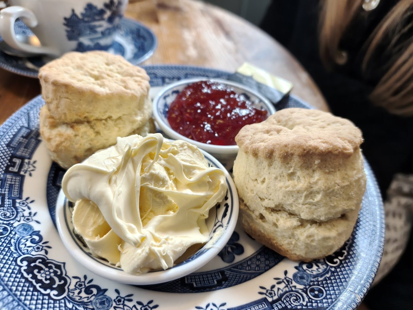 Two scones with jam and clotted cream